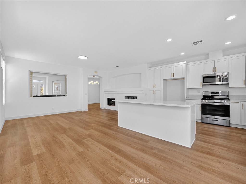 1436 Riviera Avenue Banning, CA 92220 - Photo 10 of 43 a view of kitchen with kitchen island microwave and cabinets