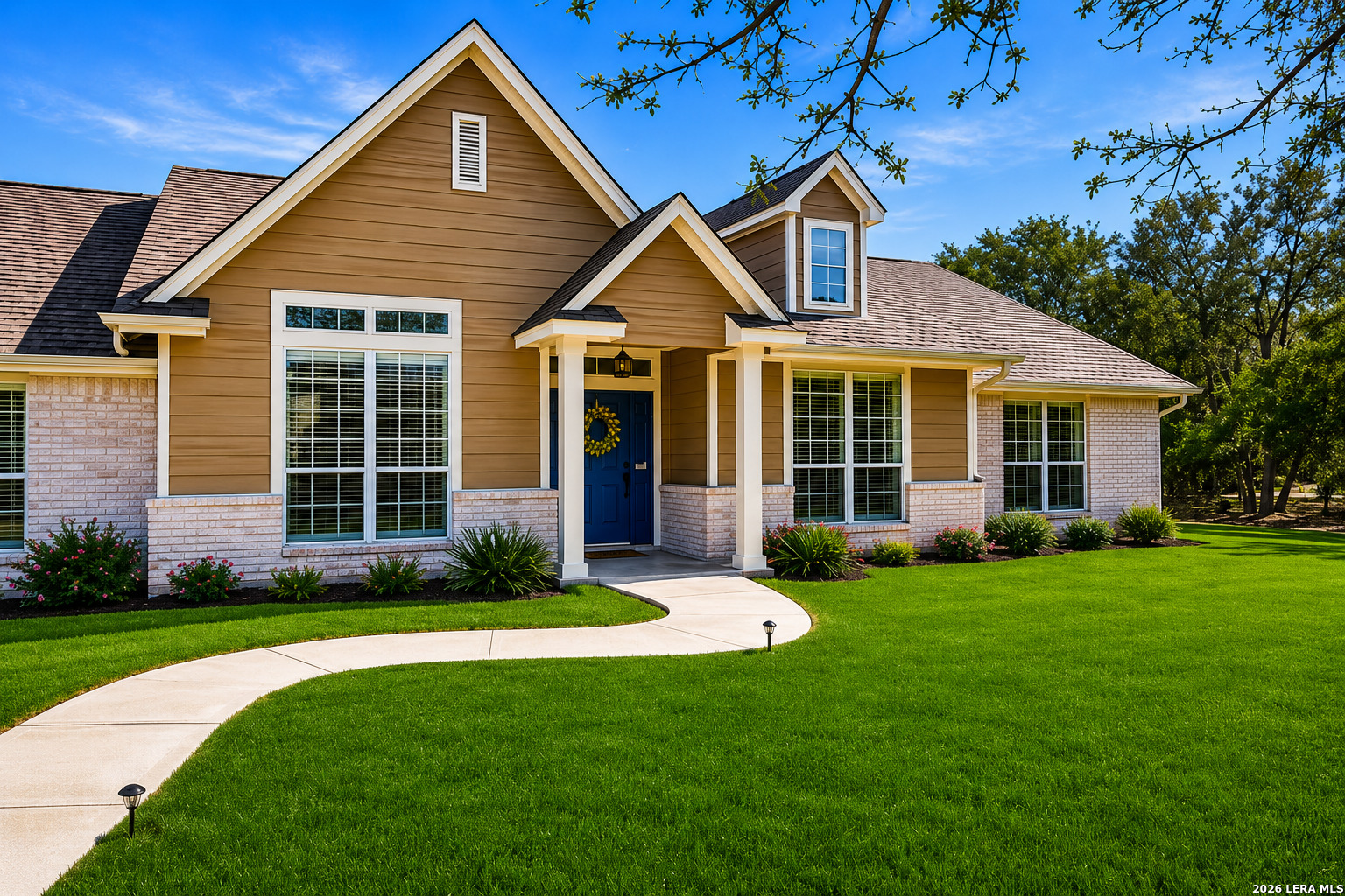 a front view of a house with a yard