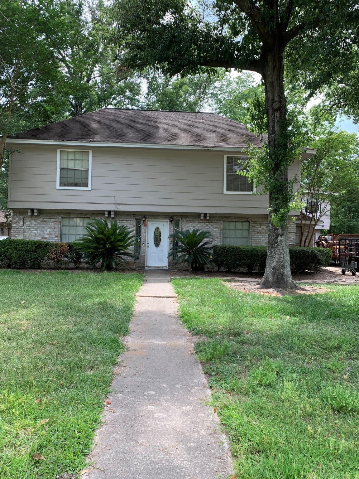 902 Appomattox Drive Spring, TX 77380 - Photo 1 of 18 a front view of a house with a yard and a large tree
