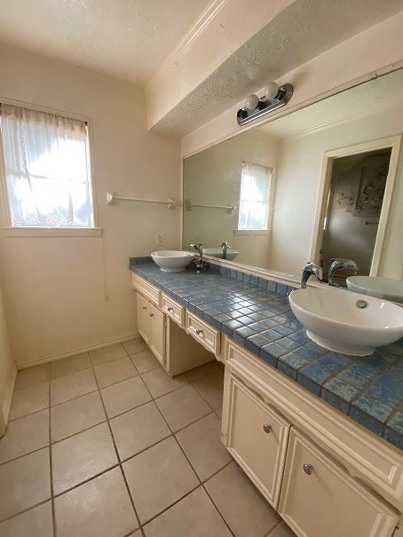 902 Appomattox Drive Spring, TX 77380 - Photo 12 of 18 a bathroom with a granite countertop sink a mirror and vanity