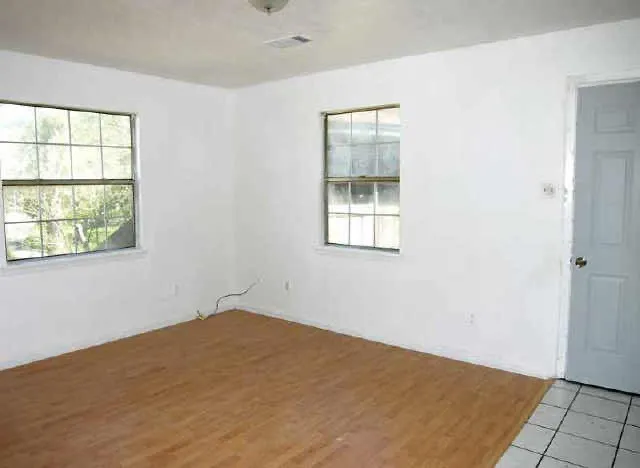 an empty room with windows