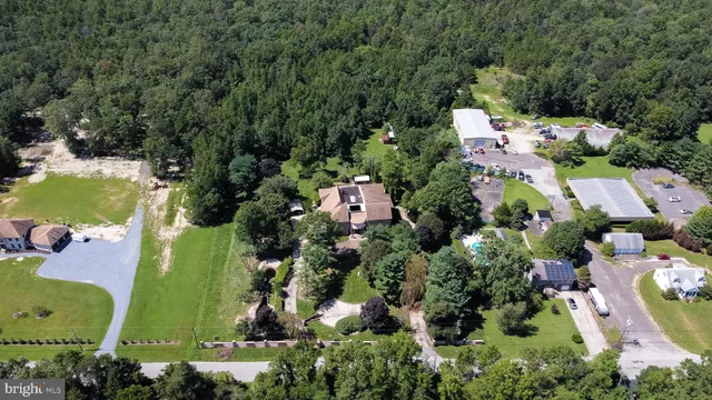 a view of a field with trees in the background