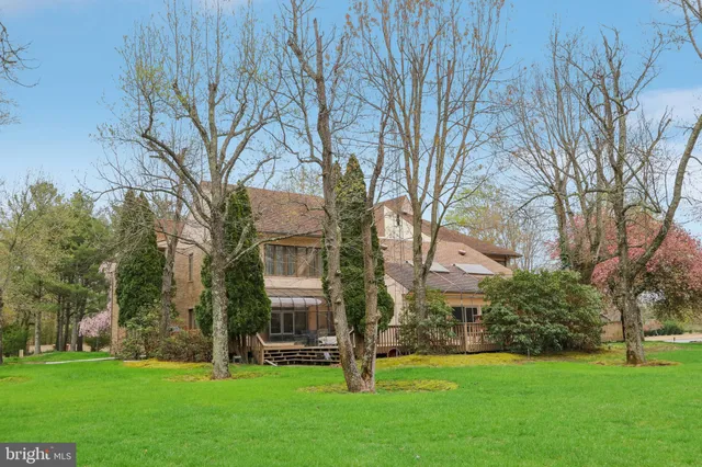 a view of house with a garden