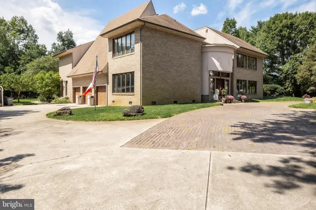 a view of a yard with large trees