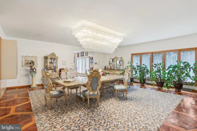 a bathroom with a sink a mirror a bathtub and shower