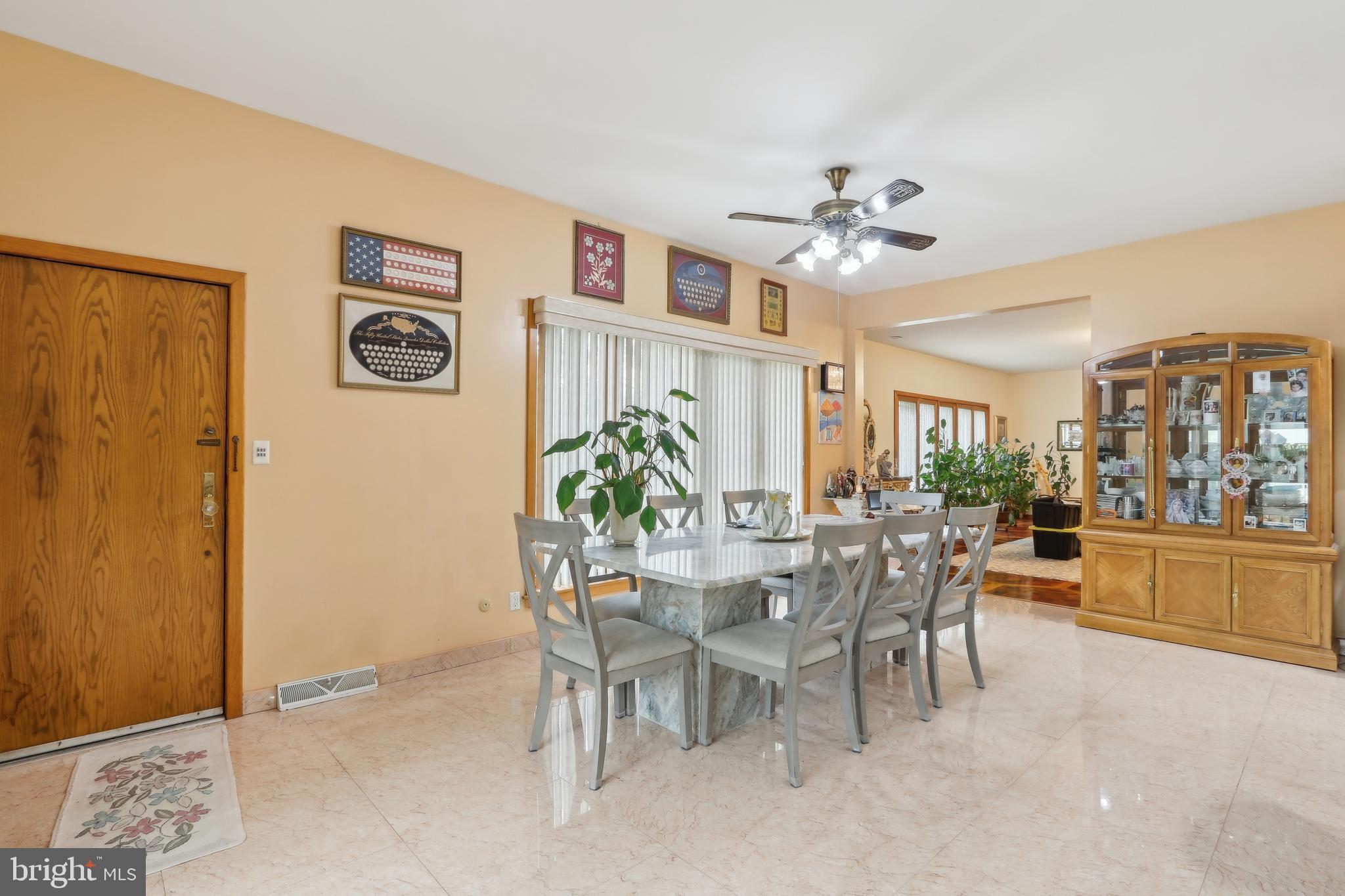 27 Cannon Range Road Milmay, NJ 08340 - Photo 42 of 95 a view of a dining room and livingroom with furniture window and wooden floor