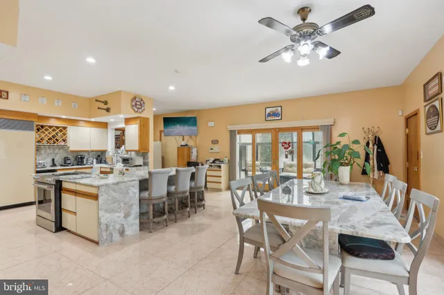 a room with a large window and stainless steel appliances