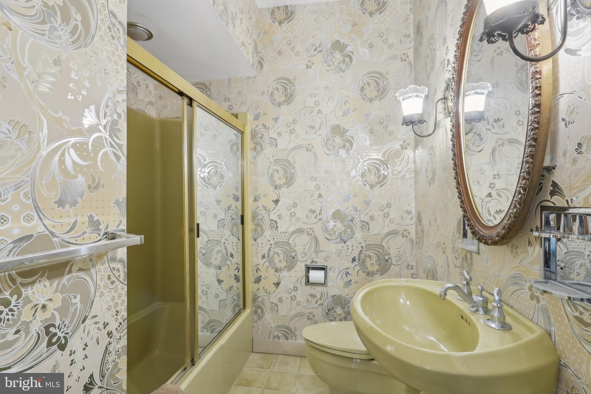 27 Cannon Range Road Milmay, NJ 08340 - Photo 67 of 95 a bathroom with a sink a mirror a bathtub and shower