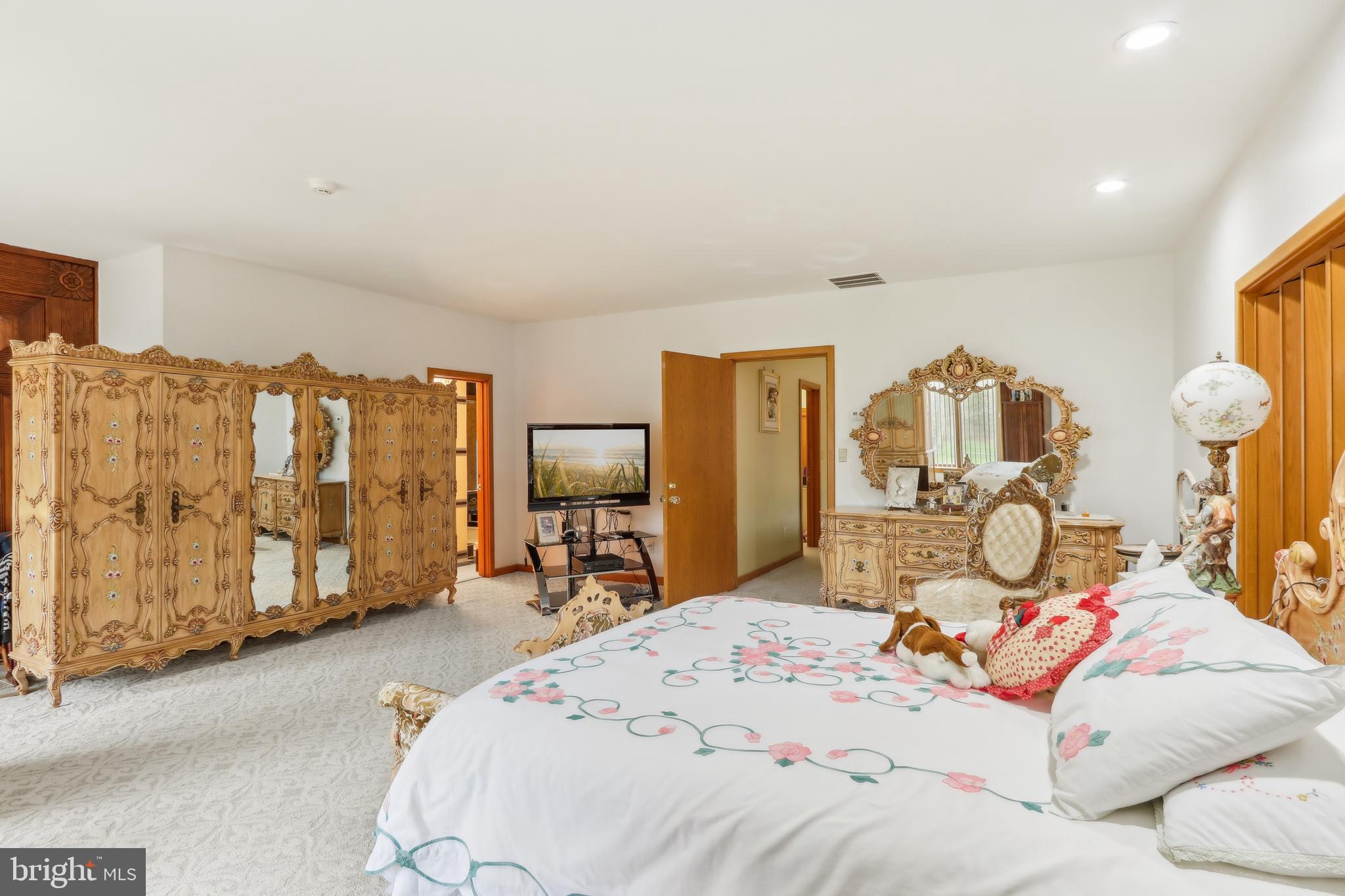 27 Cannon Range Road Milmay, NJ 08340 - Photo 74 of 95 a bedroom with a bed and dresser with mirror