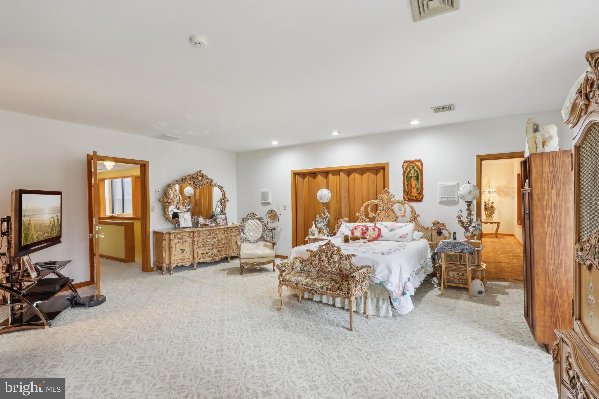 27 Cannon Range Road Milmay, NJ 08340 - Photo 77 of 95 a bed room with furniture and a flat screen tv