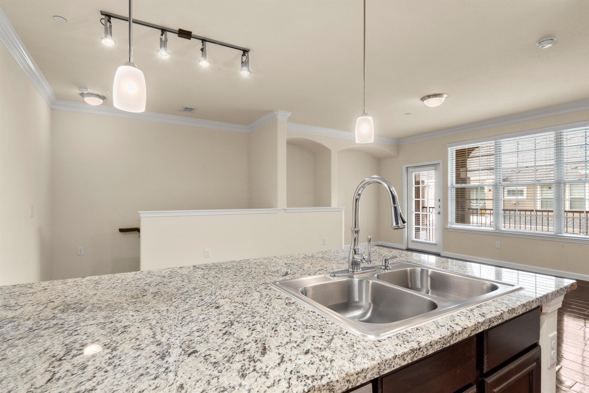 29980 Fm 2978 Road, Unit A7 Magnolia, TX 77354 - Photo 3 of 10 a kitchen with a sink a counter space and a wooden floor