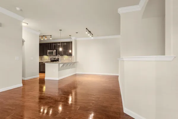 a view of a kitchen with microwave and cabinets