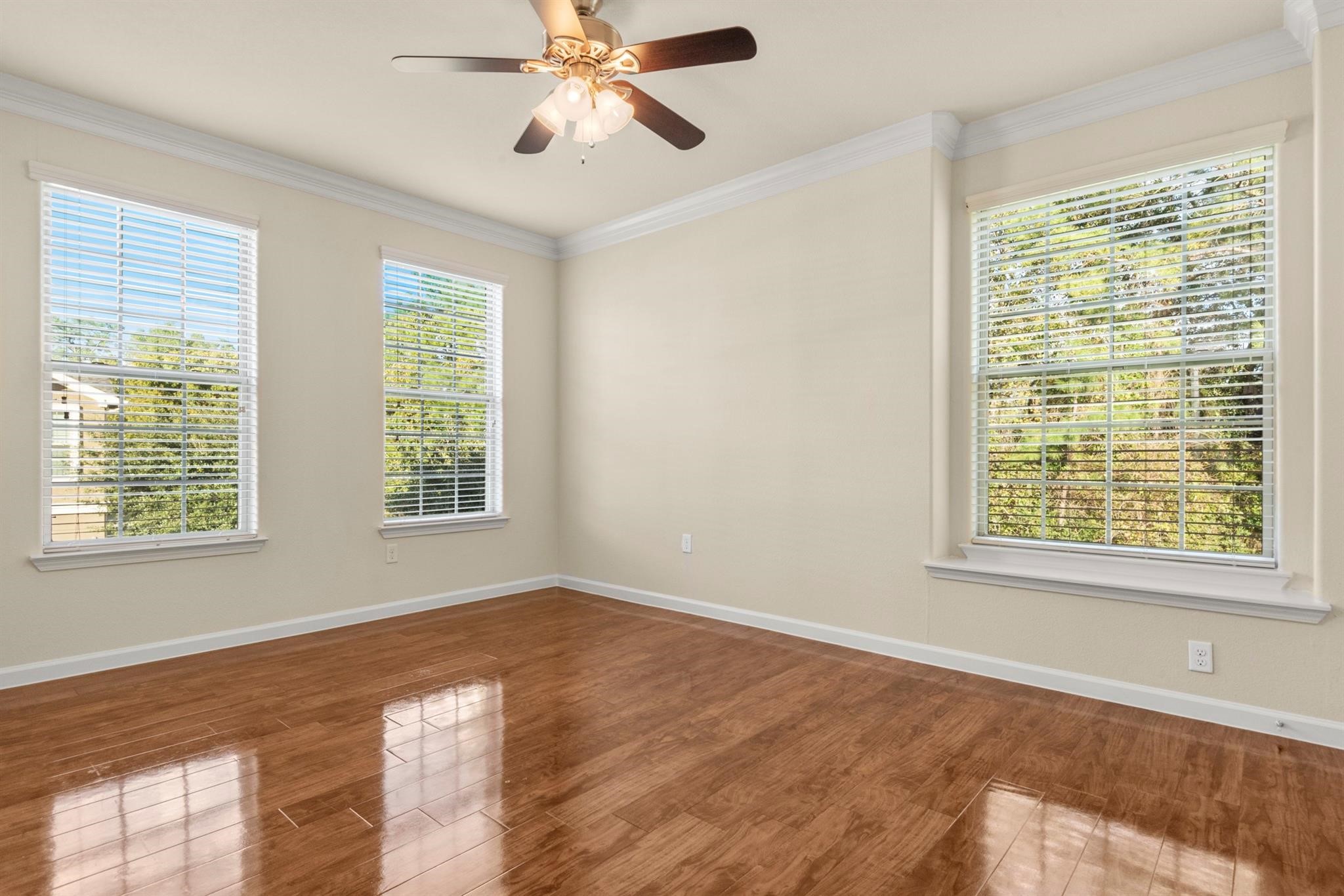 29980 Fm 2978 Road, Unit A7 Magnolia, TX 77354 - Photo 8 of 10 a view of an empty room with a window and wooden floor