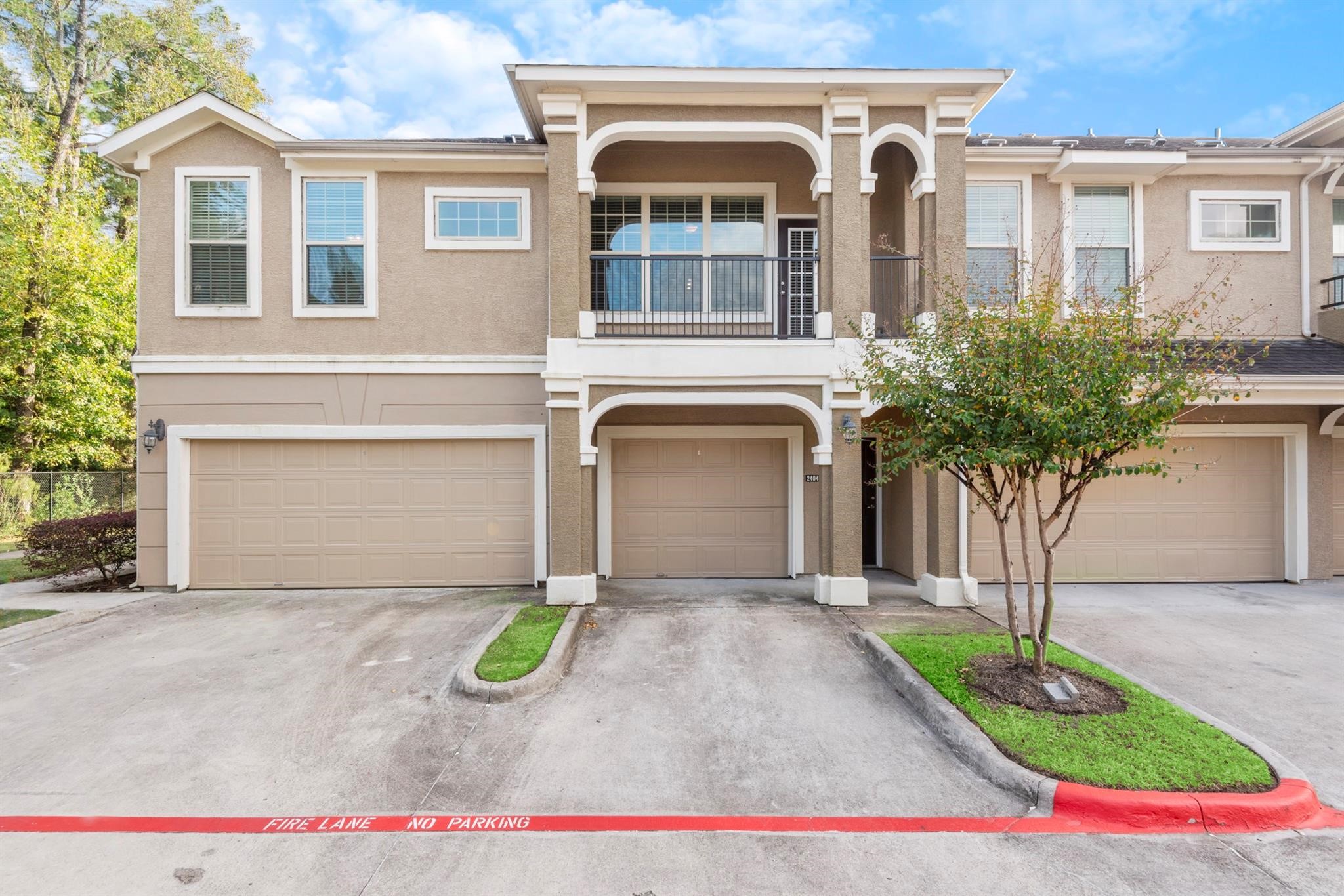 29980 Fm 2978 Road, Unit A7 Magnolia, TX 77354 - Photo 10 of 10 a front view of a house with garden
