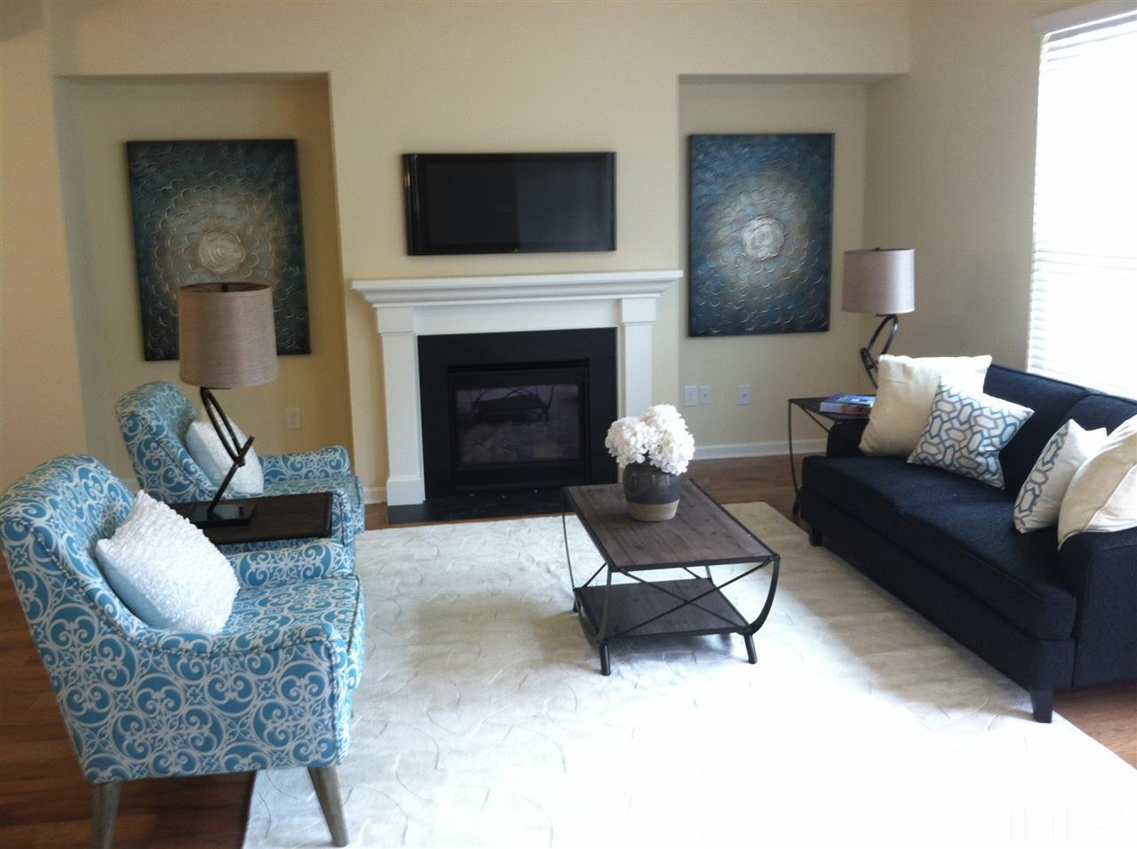723 Edgewater Ridge Court Apex, NC 27523 - Photo 3 of 25 Family room of similar home.