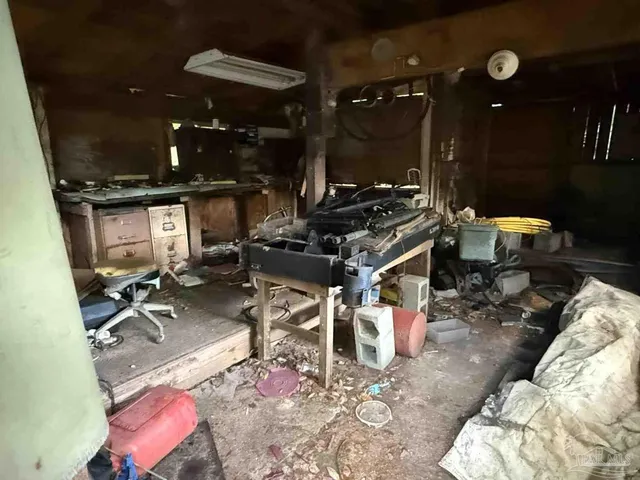 a view of a patio with table and chairs