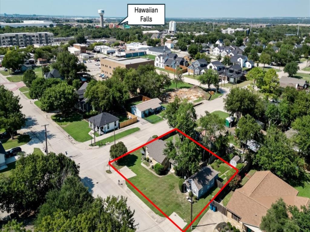 an aerial view of residential house with outdoor space and swimming pool