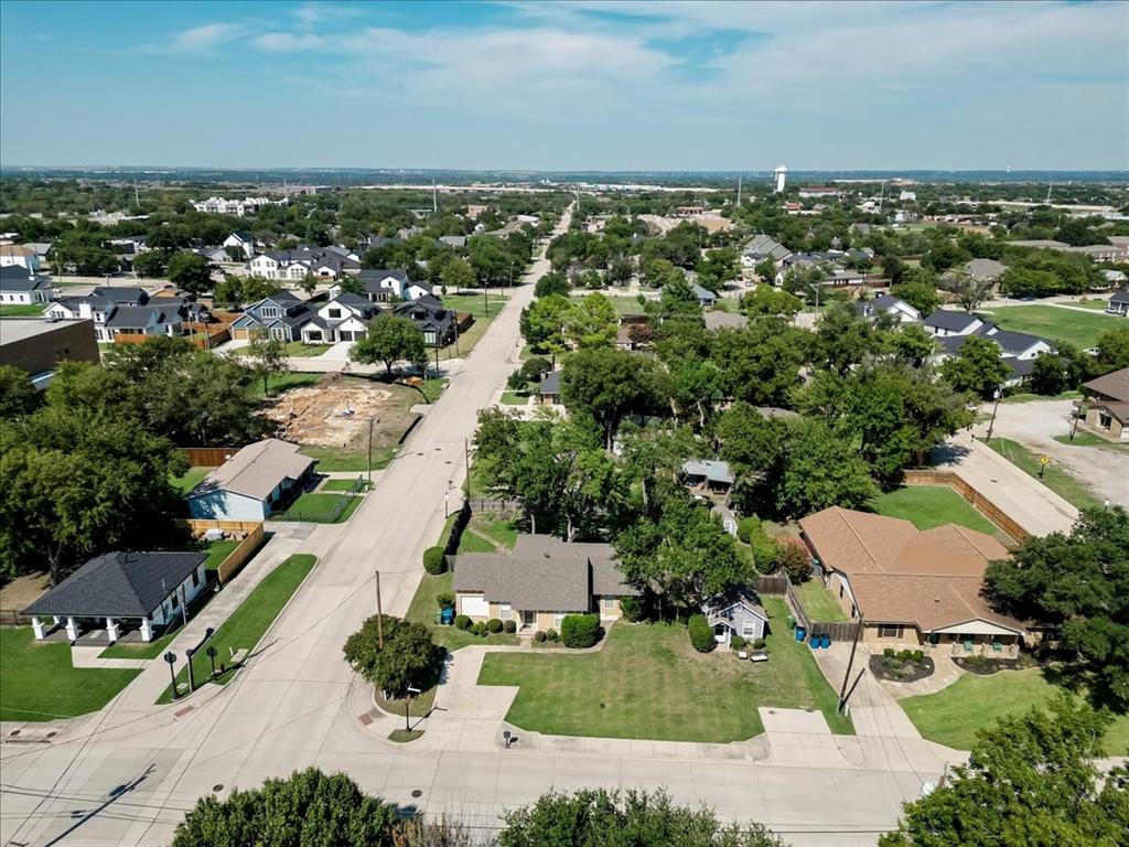401 Main Street Roanoke, TX 76262 - Photo 5 of 10 an aerial view of residential houses with outdoor space and trees