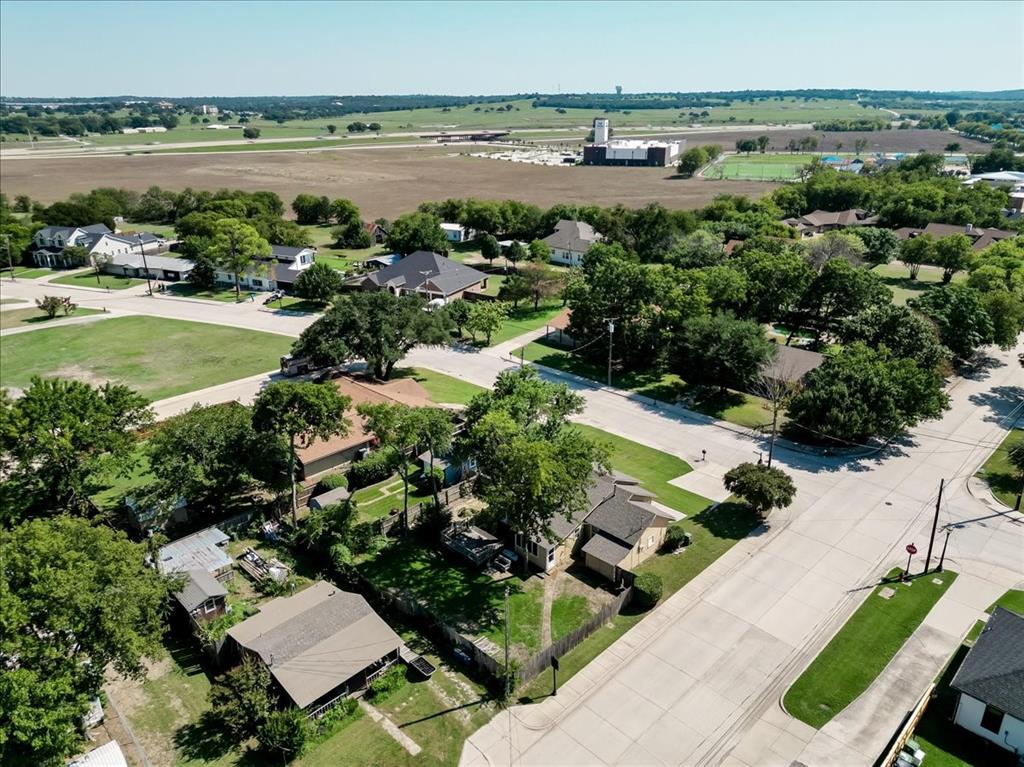401 Main Street Roanoke, TX 76262 - Photo 8 of 10 a view of a lake with a building in the back