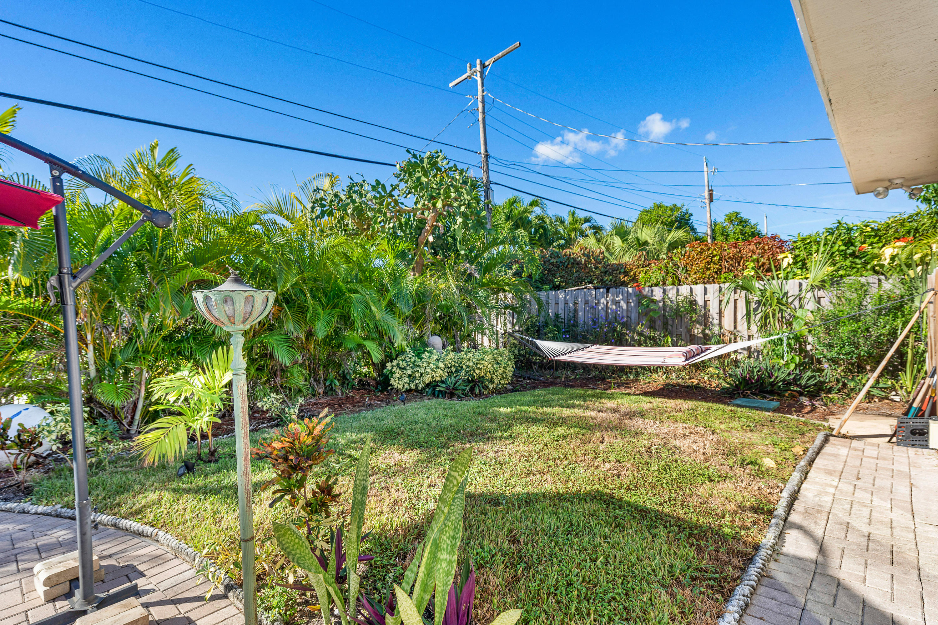 208 Bamboo Road Palm Beach Shores, FL 33404 - Photo 25 of 30 a view of a yard with plants