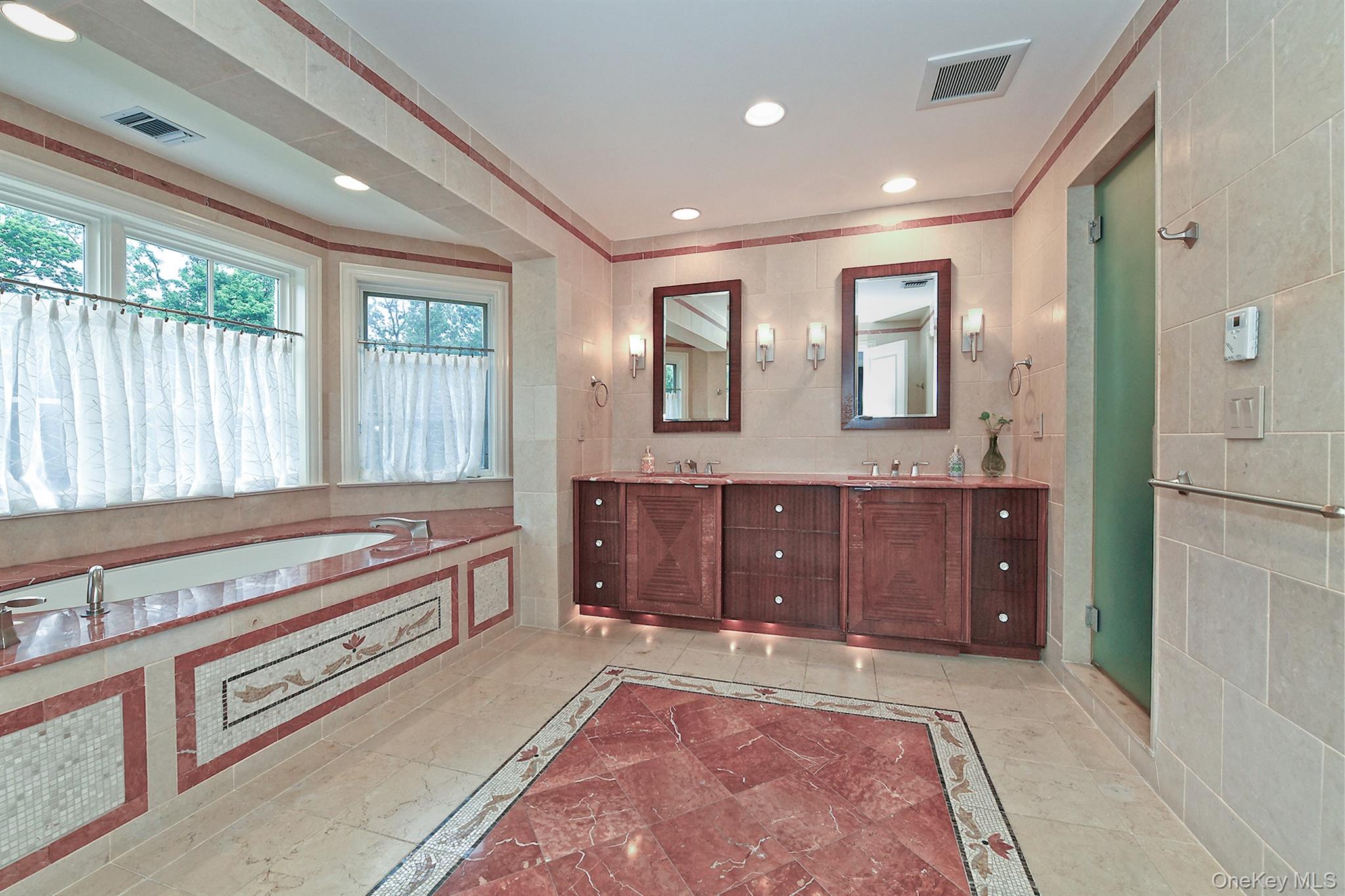 14 Norgate Road Glen Head, NY 11545 - Photo 23 of 44 a spacious bathroom with a sink and a large mirror