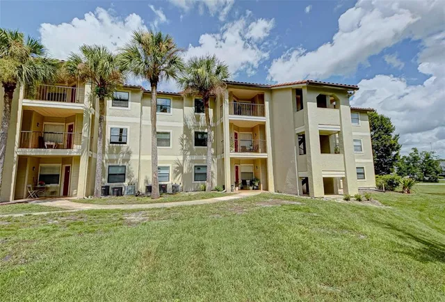 a front view of a building with a garden