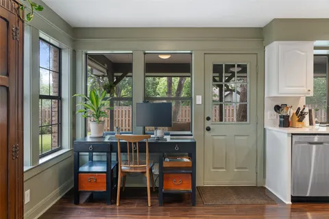 a view of a dining room with furniture and window