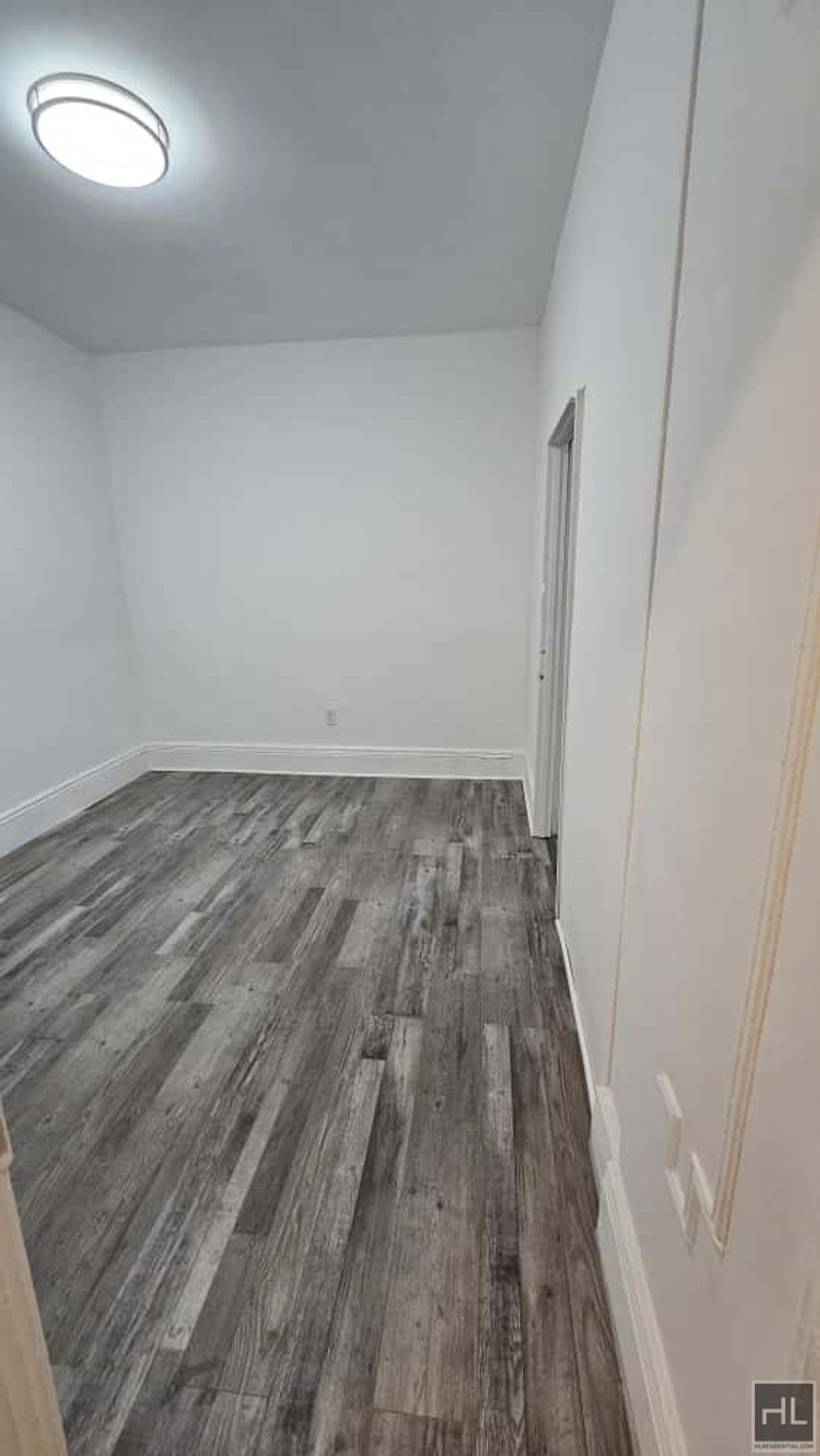 788 Macon Street, Unit 2 Brooklyn, NY 11233 - Photo 11 of 19 a view of a room with wooden floor