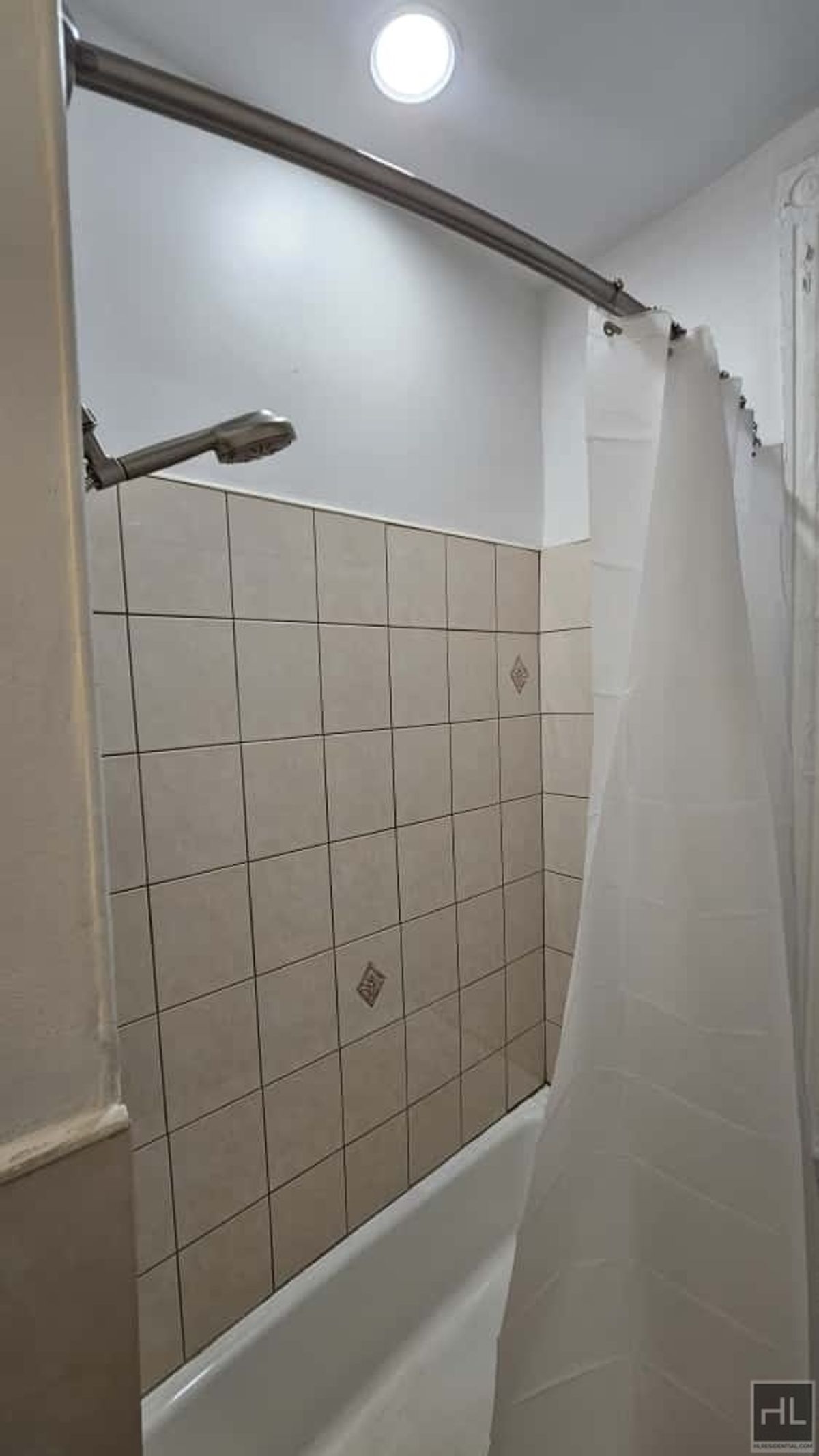 788 Macon Street, Unit 2 Brooklyn, NY 11233 - Photo 14 of 19 a bathroom with a shower and a bathtub