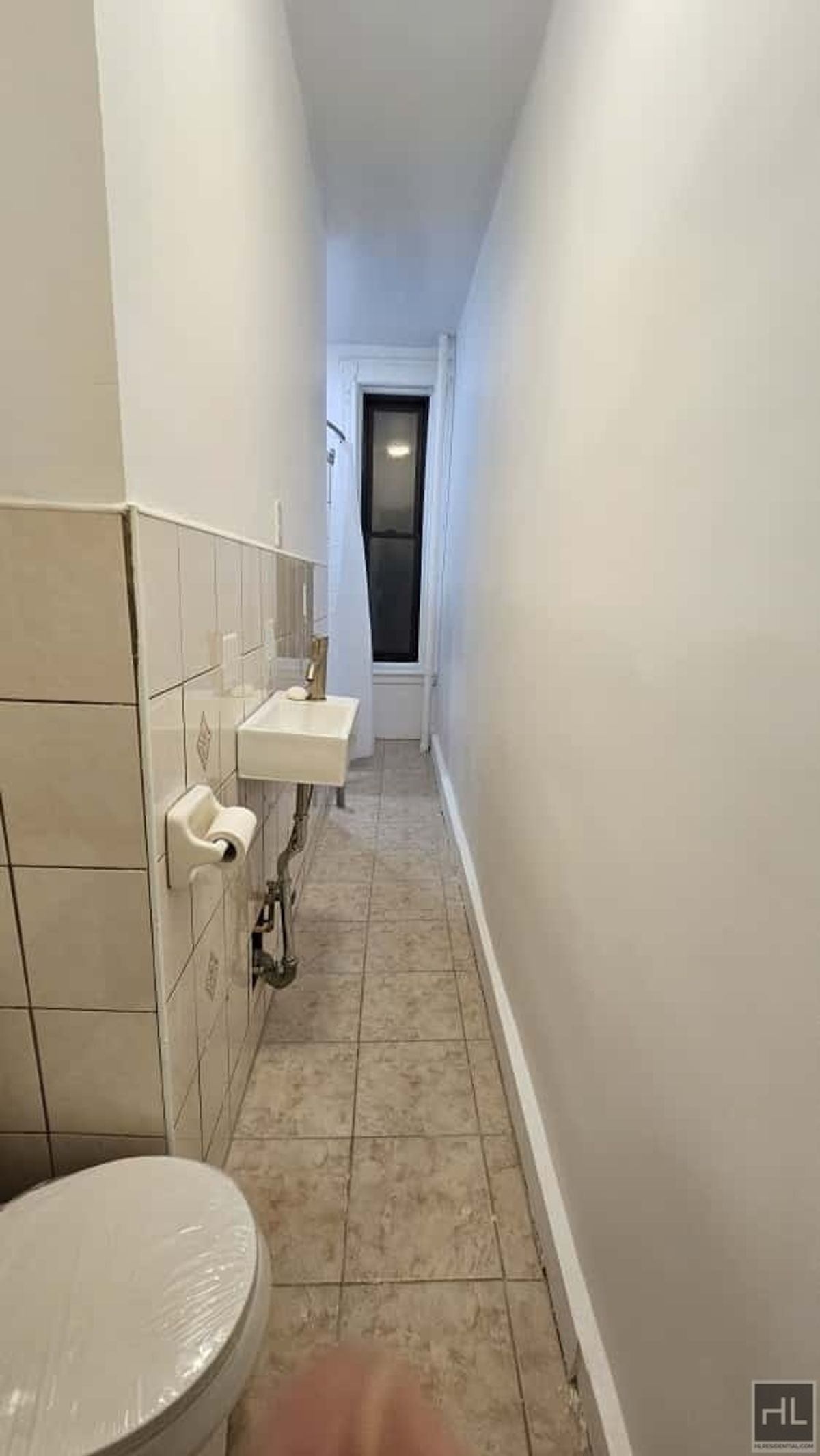 788 Macon Street, Unit 2 Brooklyn, NY 11233 - Photo 15 of 19 a bathroom with a sink and a toilet