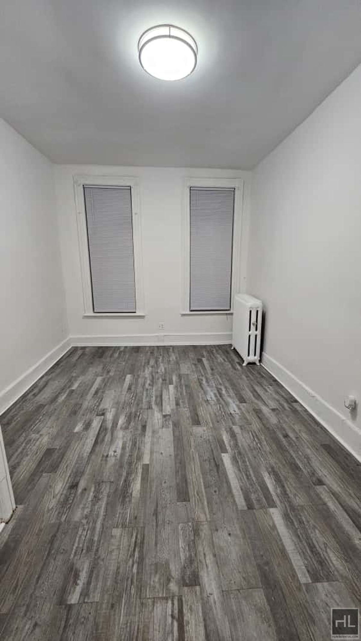 788 Macon Street, Unit 2 Brooklyn, NY 11233 - Photo 6 of 19 a view of room with wooden floor