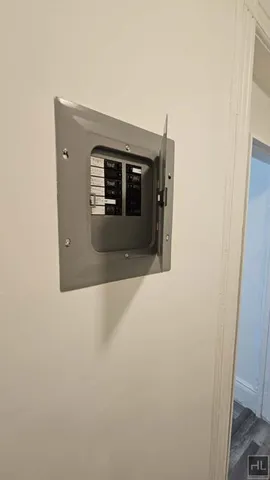 a view of a livingroom with an empty space and a window