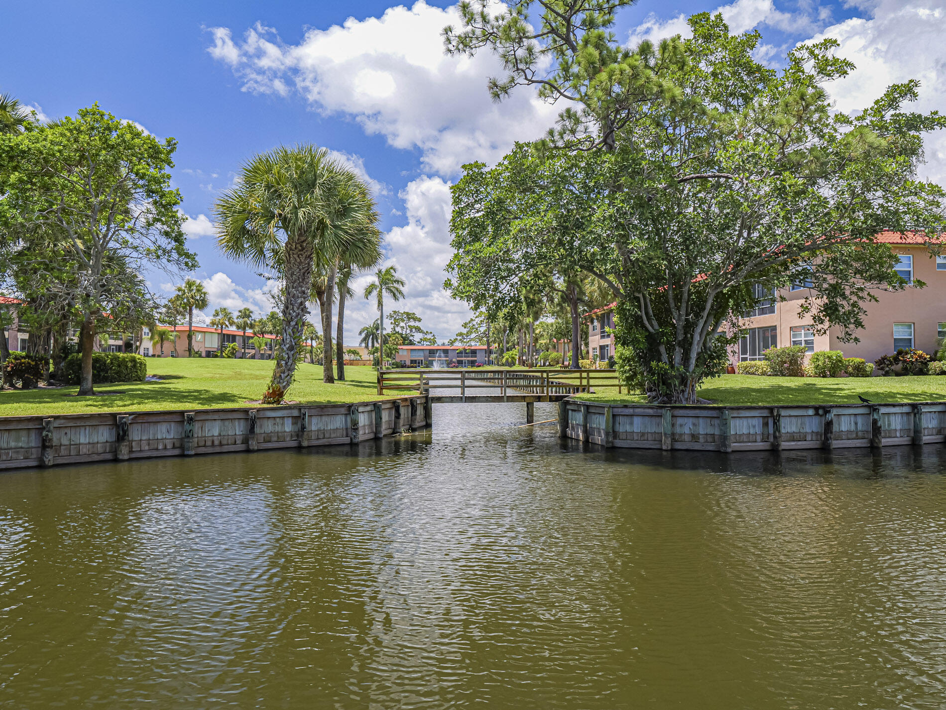 1987 Southwest Palm City Road, Unit BLDG 45 D Stuart, FL 34994 - Photo 27 of 49 a view of swimming pool with outdoor seating and lake view