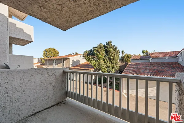 a view of balcony with two chairs