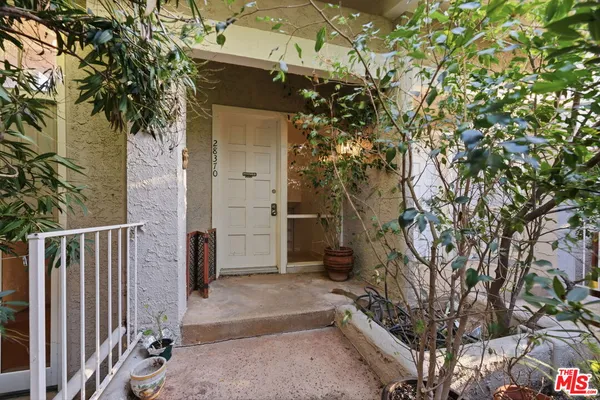 a house with a tree in front of it