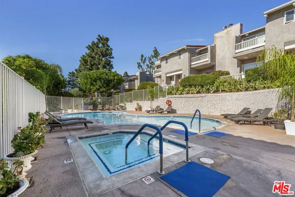 a view of a backyard with sitting area
