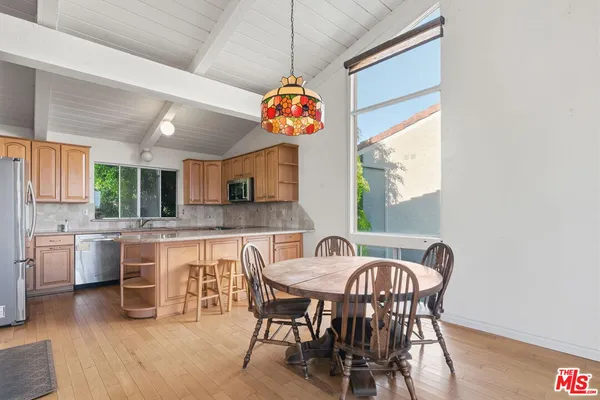a view of a dining room with furniture window and outside view