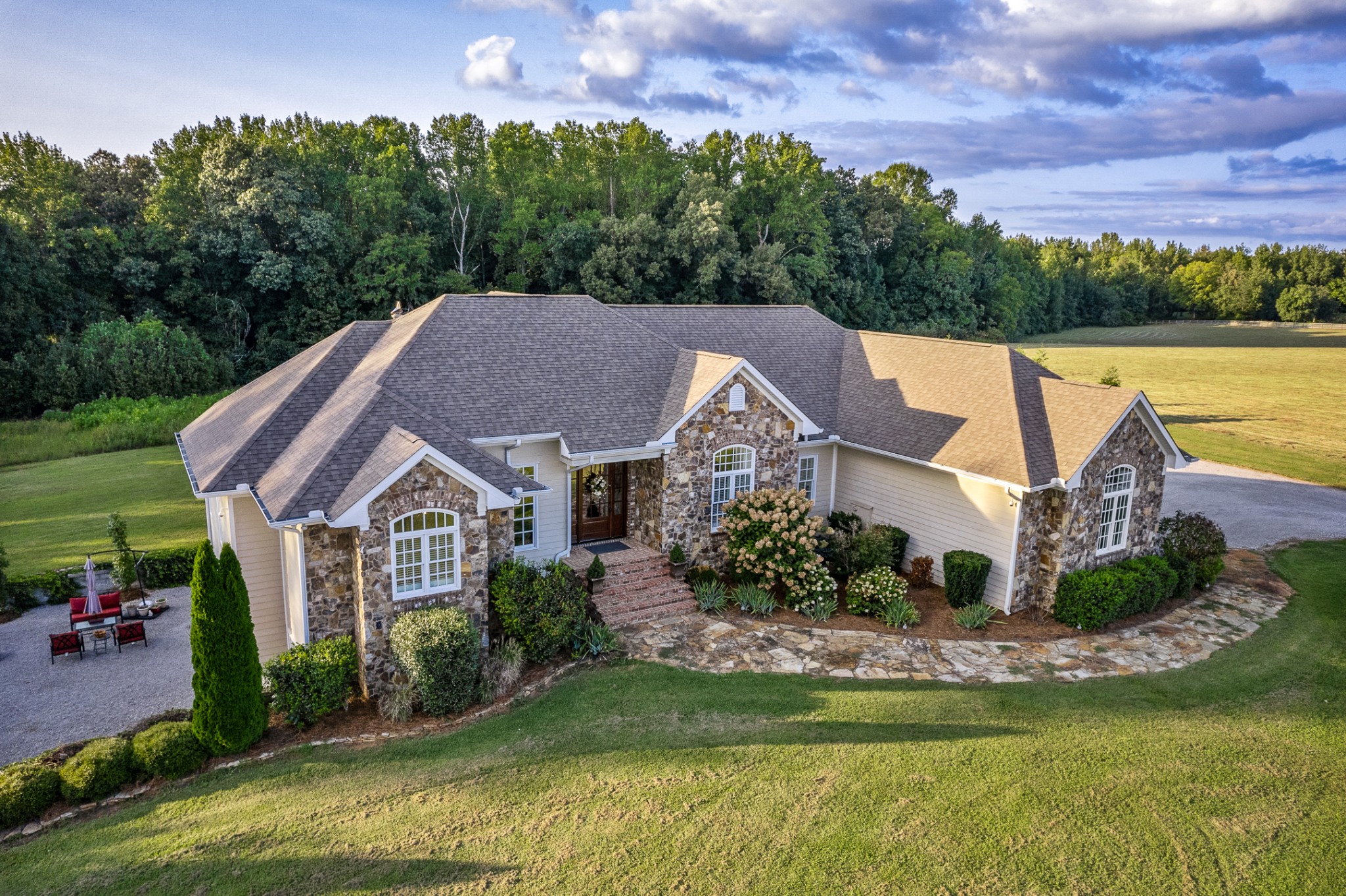 380 George Wright Road Morrison, TN 37357 - Photo 4 of 69 a front view of a house with a garden and a swimming pool