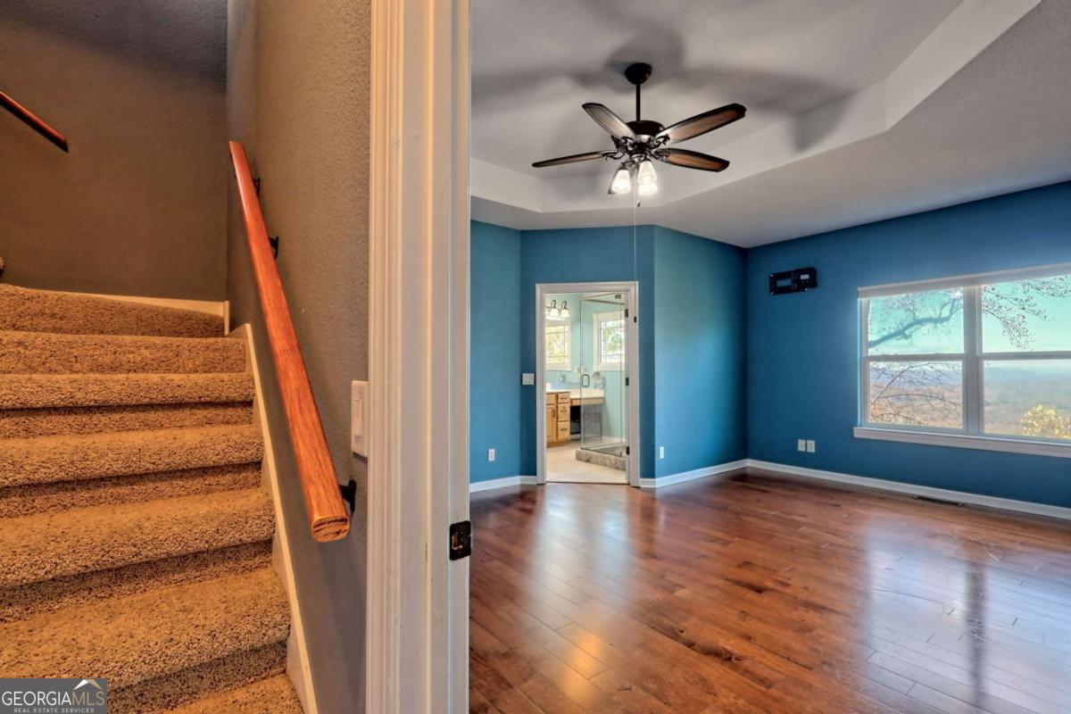 1279 Harris Ridge Road, Unit 24 Young Harris, GA 30582 - Photo 26 of 81 a view of an entryway with wooden floor and stairs