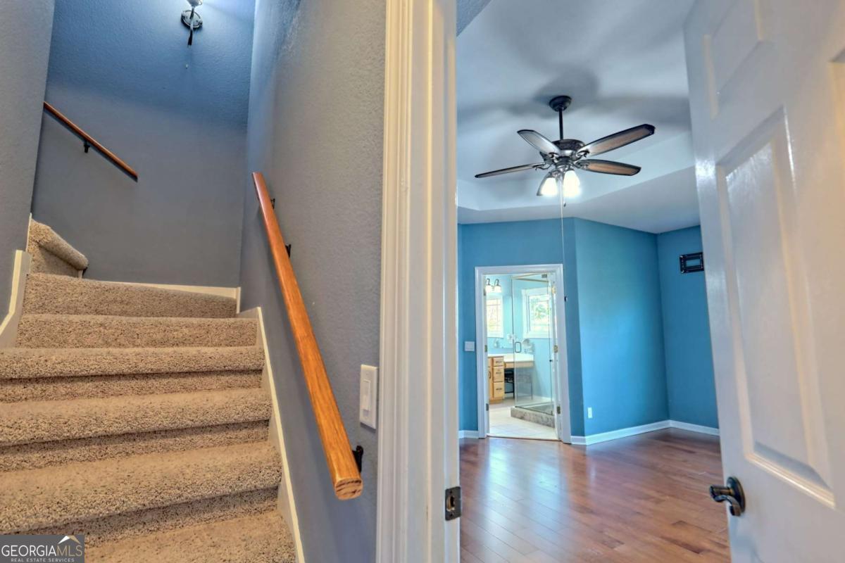 1279 Harris Ridge Road, Unit 24 Young Harris, GA 30582 - Photo 36 of 81 a view of an entryway with wooden floor and a chandelier