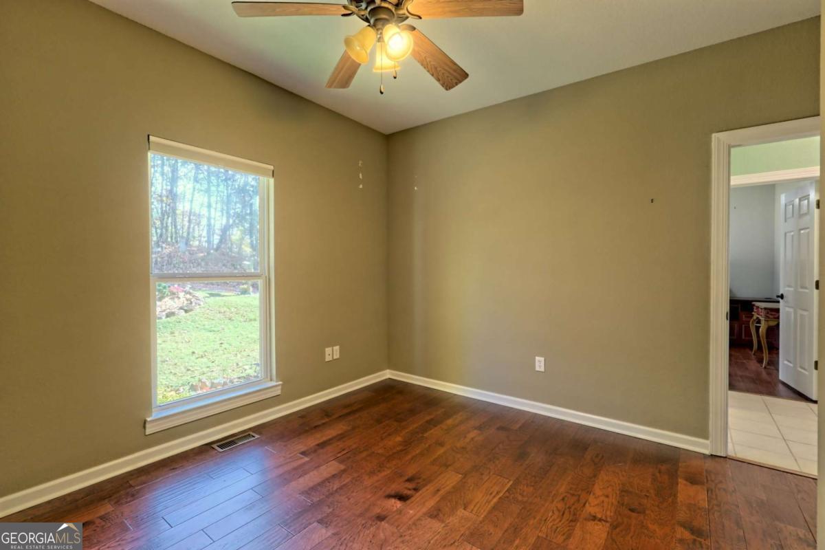 1279 Harris Ridge Road, Unit 24 Young Harris, GA 30582 - Photo 45 of 81 an empty room with wooden floor and windows