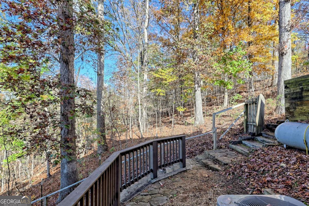 1279 Harris Ridge Road, Unit 24 Young Harris, GA 30582 - Photo 59 of 81 a view of a porch with furniture and wooden fence