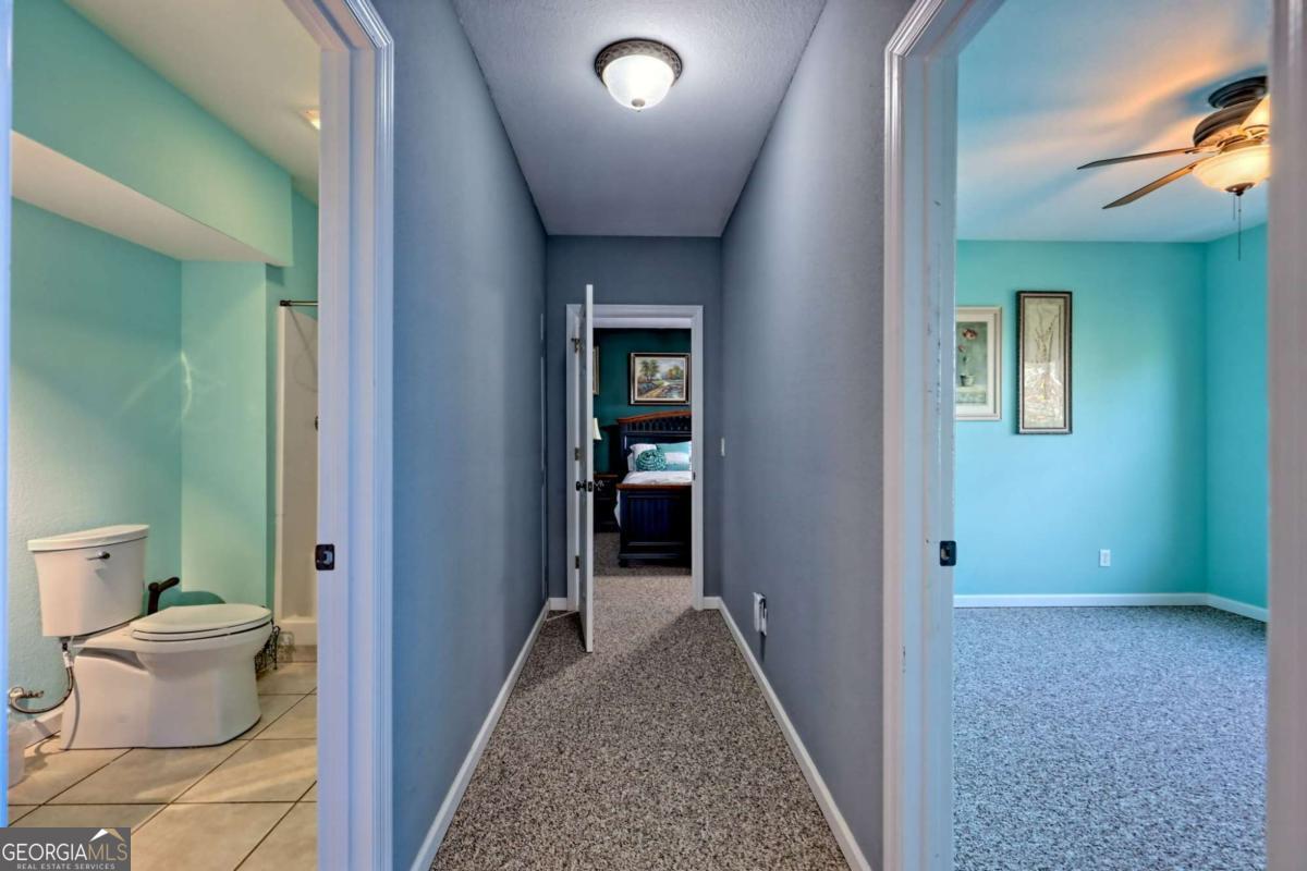 1279 Harris Ridge Road, Unit 24 Young Harris, GA 30582 - Photo 64 of 81 a view of a hallway with toilet and a potted plant