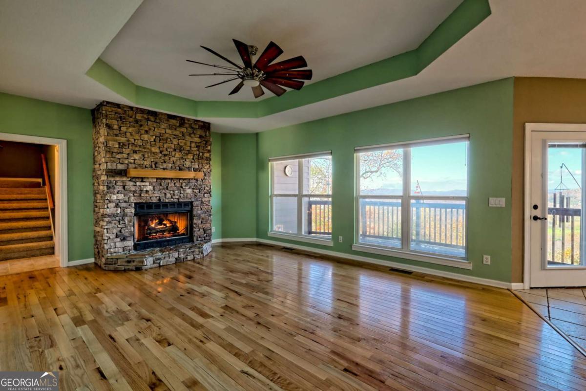 1279 Harris Ridge Road, Unit 24 Young Harris, GA 30582 - Photo 9 of 81 a view of an empty room with a window and fireplace