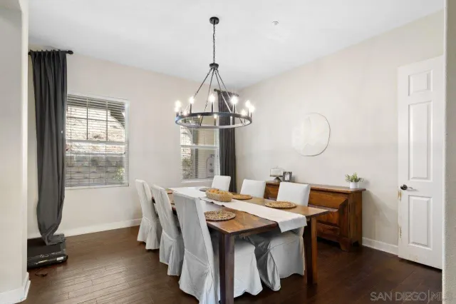 a large bathroom with a double vanity sink a mirror and a bathtub