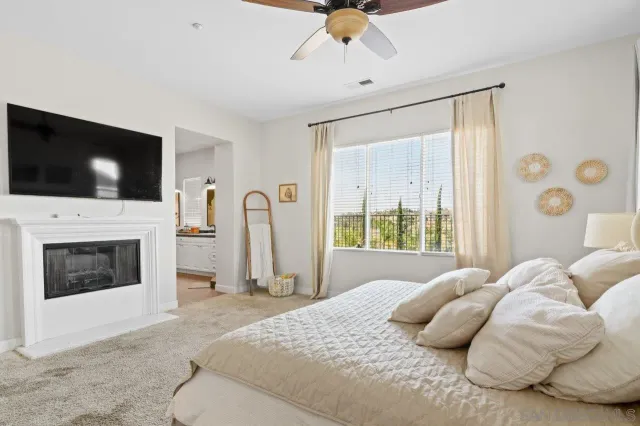 a bathroom with a sink a toilet and shower curtain
