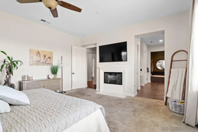 a view of a kitchen with fridge and workspace