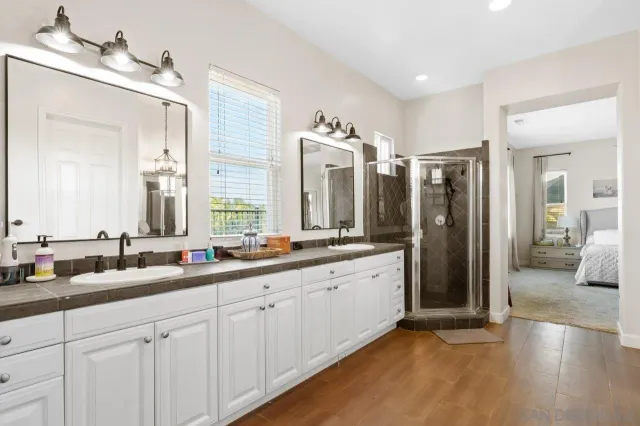 a view of a backyard with plants and a patio