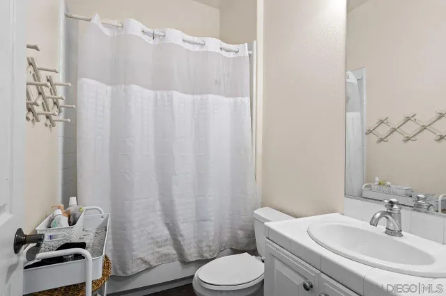 a bedroom with bed and a window