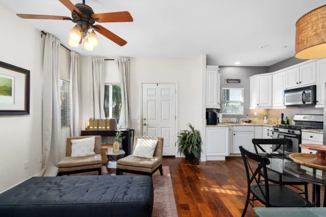 a view of a house with a yard and sitting area